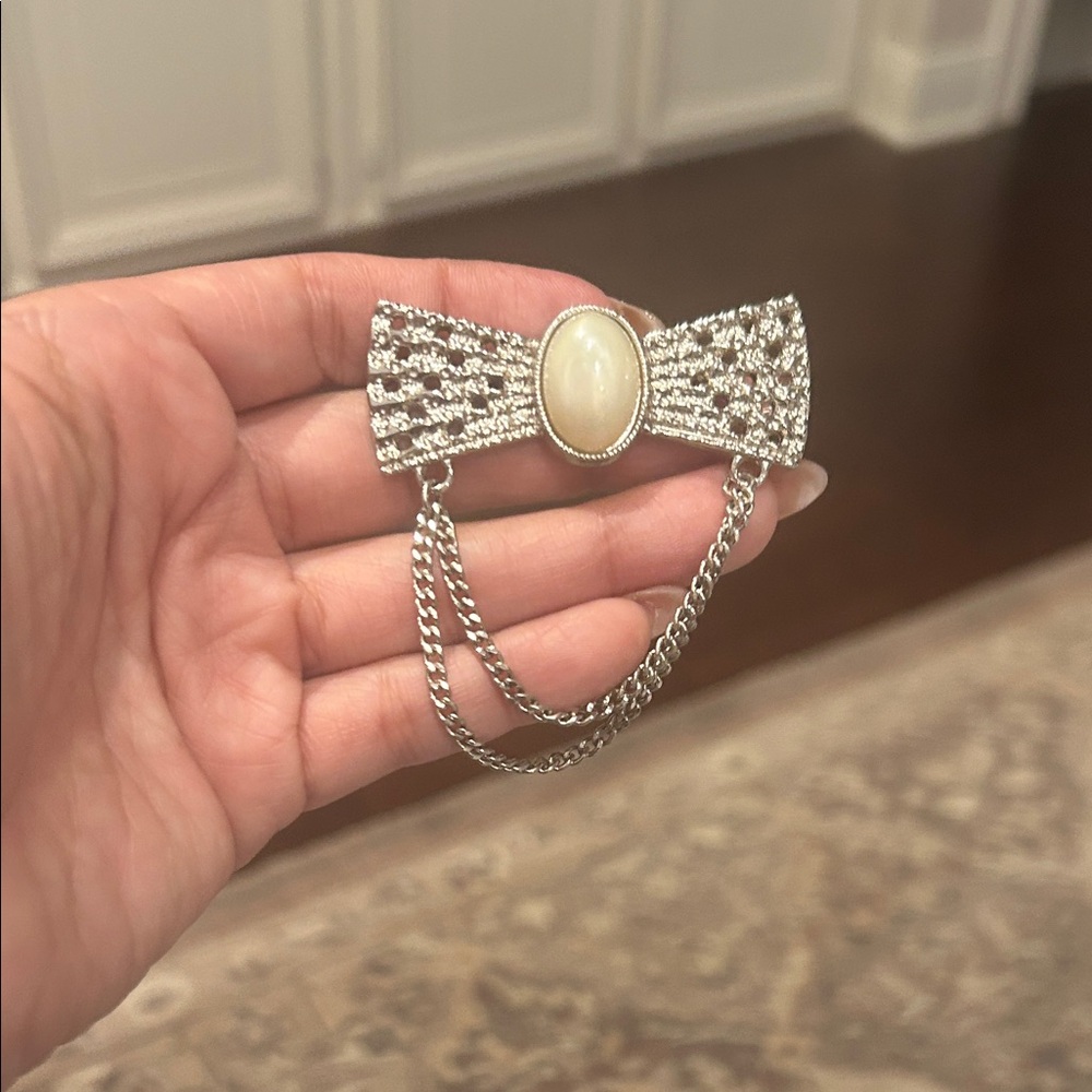 Elegant Silver and Cream Brooch with Chain